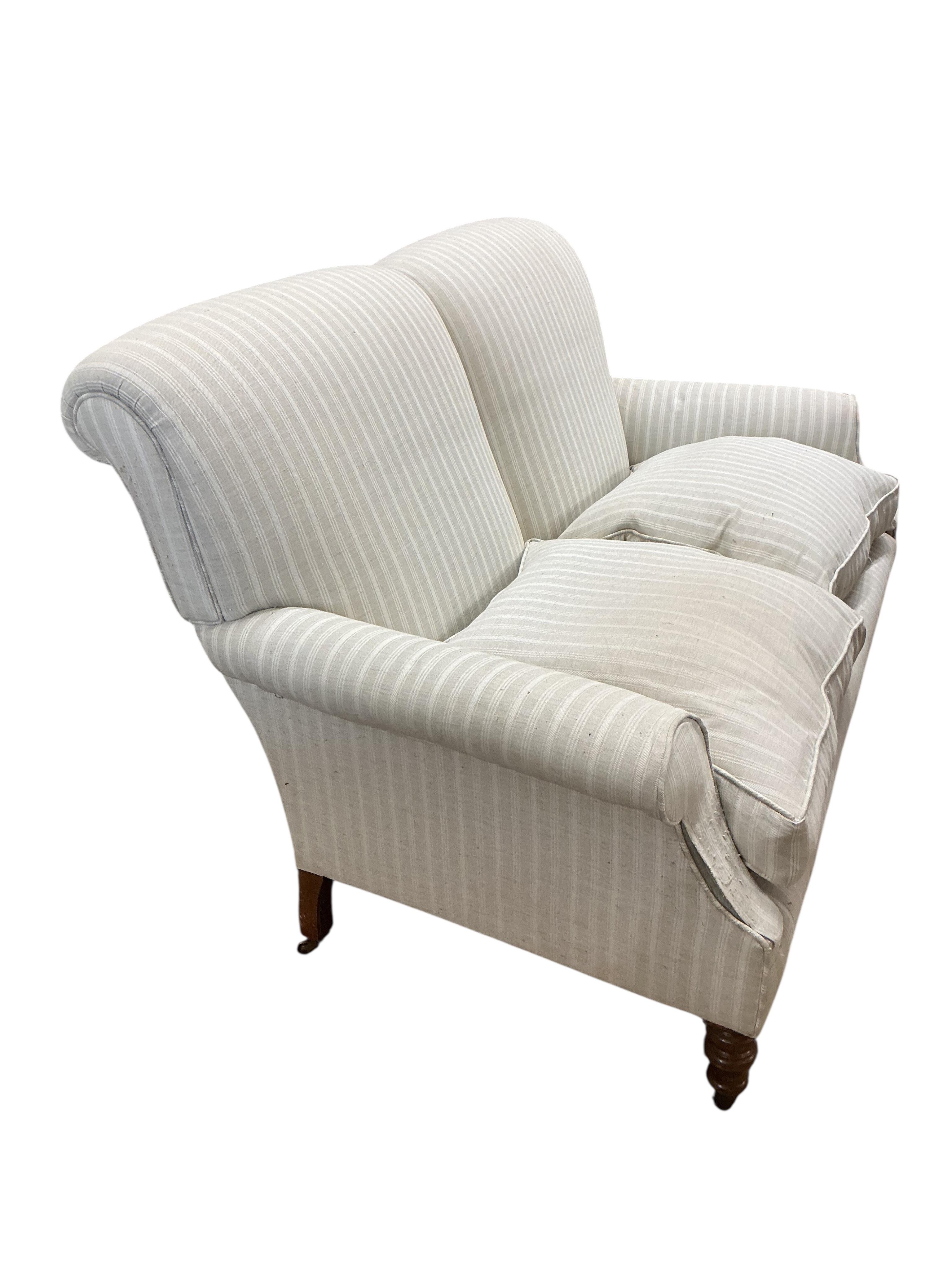 A Victorian style two seater sofa in the style of Howard & Sons, width 150cm, depth 90cm, height 88cm